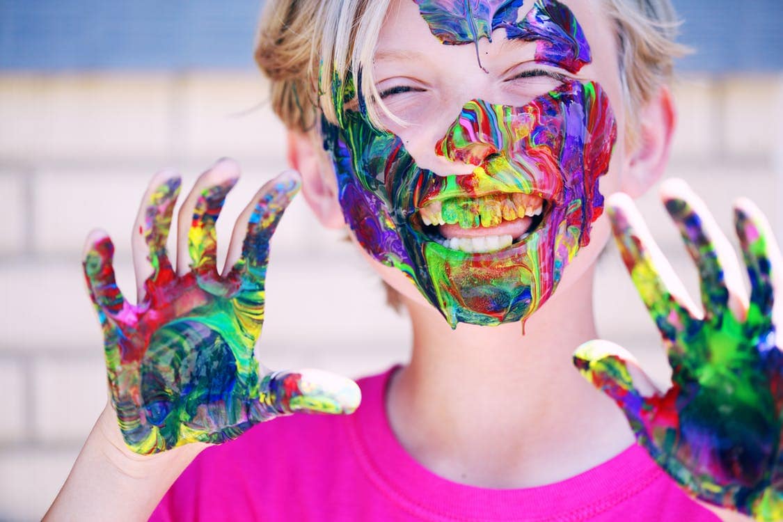 Kid with paint on hands stock photo
